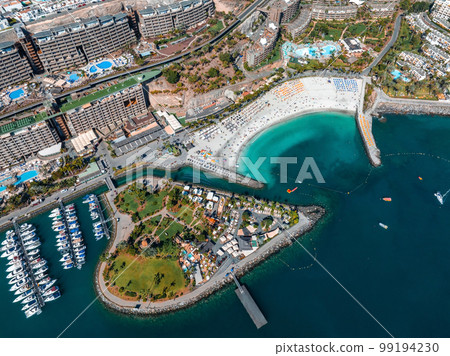 Beautiful aerial landscape with Anfi beach and resort, Gran Canaria, Spain. Luxury hotels, turquoise water, sandy beaches in Spain. Luxury beach vacation concept. Heart shaped island. 99194230