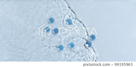 Abstract water, cosmetic background with waves and ripples and spherical granules. Concept of therapeutic moisturizing cosmetics 99195963