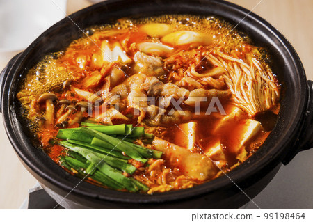 Kimchi hot pot with lots of ingredients in a black clay pot 99198464