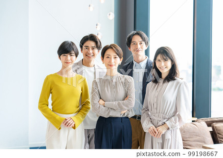 Business person male and female arms folded Business person male and female arms folded 99198667