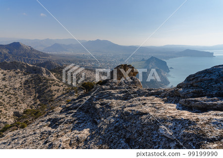 View on Sudak, sea, mount and cape from the slope of Falcon Sokol mountain at morning . Crimea 99199990