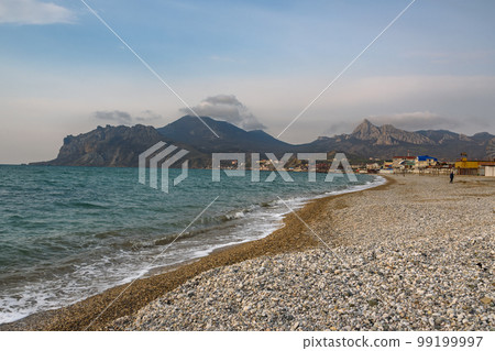 Empty pebble beach in spring. Koktebel. Crimea Empty pebble beach in spring. Koktebel. Crimea 99199997