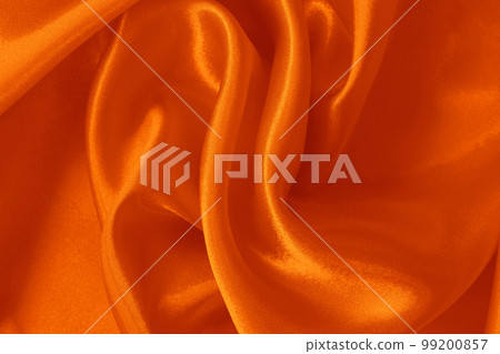 Orange fabric cloth texture for background and design art work, beautiful crumpled pattern of silk or linen. 99200857