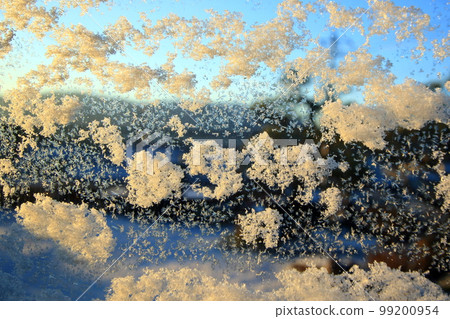 Snow (crystals) adhering to the glass window Snow (crystals) adhering to the glass window 99200954