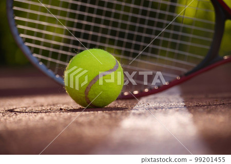 Tennis ball, racquet and hard court surface corner line Tennis ball, racquet and hard court surface corner line 99201455