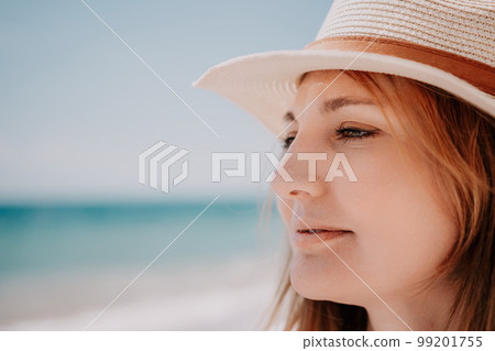 Young woman in red bikini on Beach. Blonde in sunglasses on pebble beach enjoying sun. Happy lady in one piece red swimsuit relaxing and sunbathing by turquoise sea ocean on hot summer day. Close up Young woman in red bikini on Beach. Blonde in sunglasses on pebble beach enjoying sun. Happy lady in one piece red swimsuit relaxing and sunbathing by turquoise sea ocean on hot summer day. Close up 99201755