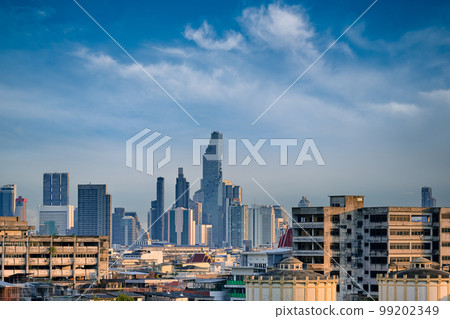 Cityscape of Bangkok city center in evening, blue sky and clouds, Thailand.  99202349