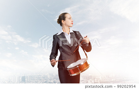 Young business woman with a drum 99202954