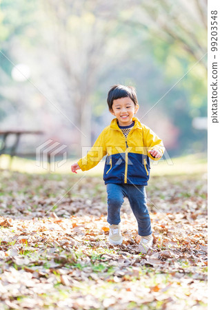 Children playing in the park 99203548