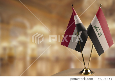 Small flags of the Iraq on an abstract blurry background Small flags of the Iraq on an abstract blurry background 99204235