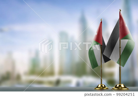 Small flags of the Jordan on an abstract blurry background Small flags of the Jordan on an abstract blurry background 99204251