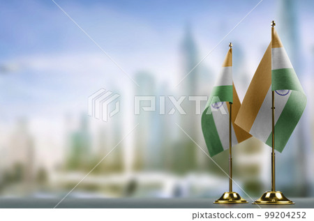 Small flags of the India on an abstract blurry background Small flags of the India on an abstract blurry background 99204252