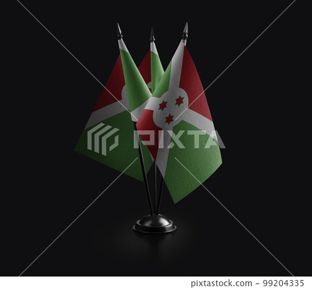 Small national flags of the Burundi on a black background 99204335