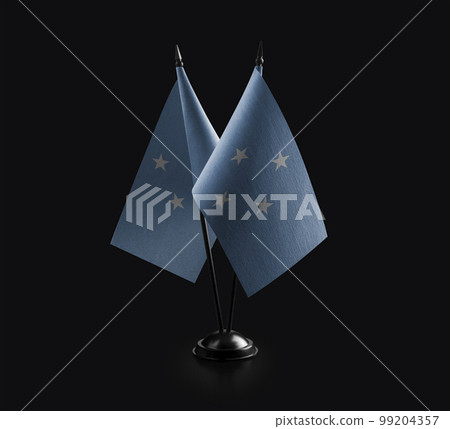 Small national flags of the Federated States Micronesia on a black background 99204357
