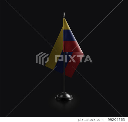 Small national flag of the Venezuela on a black background 99204363