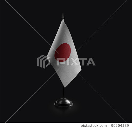 Small national flag of the Japan on a black background 99204389