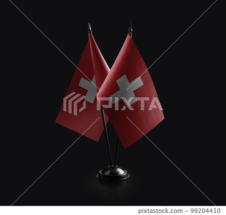 Small national flags of the Switzerland on a black background Small national flags of the Switzerland on a black background 99204410