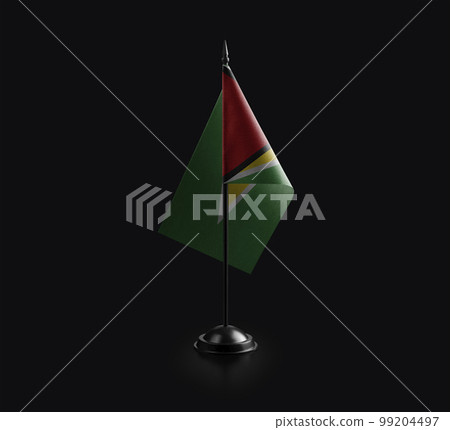 Small national flag of the Guyana on a black background 99204497