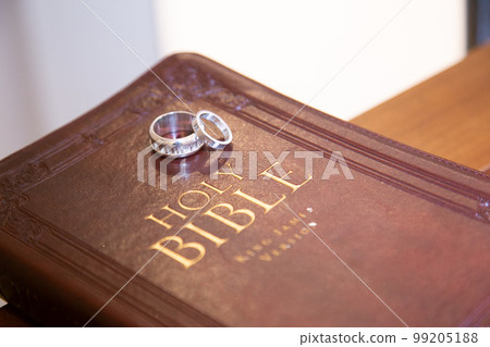 Image of a wedding with a bible and a ring 99205188
