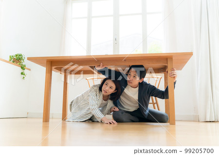 Earthquake middle-aged couple hide Earthquake middle-aged couple hide 99205700