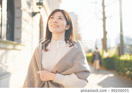 Woman smiling outdoors in winter - Stock Photo [99208055] - PIXTA