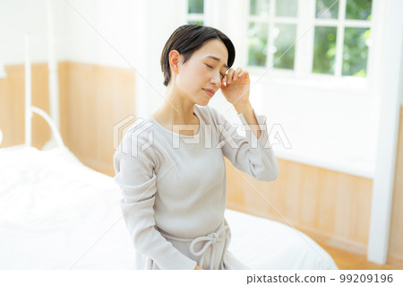 The woman in the bedroom The woman in the bedroom 99209196