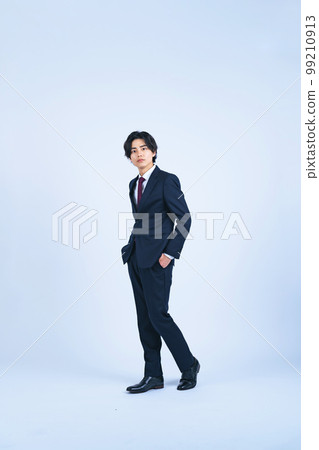 A young businessman standing in a suit (Cutout PNGs are also on sale! See author profile) 99210913