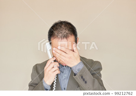 A state of a middle-aged man consulting on the phone A state of a middle-aged man consulting on the phone 99212762