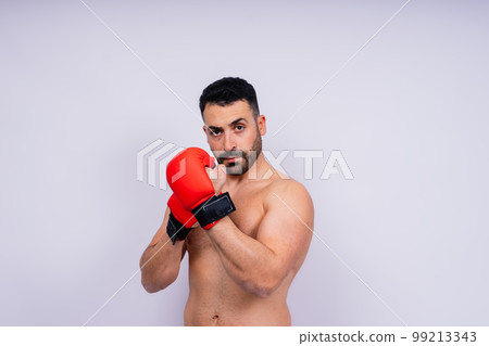 Young caucasian handsome man isolated on white background with boxing gloves 99213343