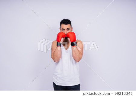Young caucasian handsome man isolated on white background with boxing gloves 99213345