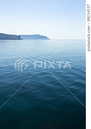 Beautiful calm summer sea Landscape with deep blue water Beautiful calm summer sea Landscape with deep blue water 99214537