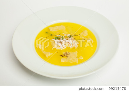 Homemade fresh creamy soup with chicken, vegetables in white bowl close up Homemade fresh creamy soup with chicken, vegetables in white bowl close up 99215478
