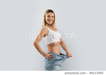 Attractive middle aged lady showing detox results 99215995