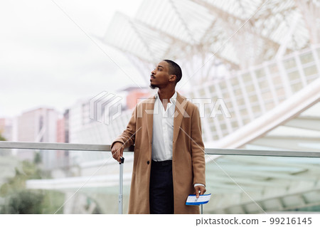 Young African American Man Waiting For His Flight In Modern Airport 99216145