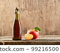 Apple vinegar cider with apple fruits on old wooden background. Fermented product 99216500