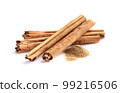 Cinnamon bark with powder in closeup 99216506