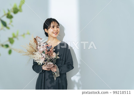 Woman with bouquet Woman with bouquet 99218511