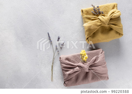 Eco-friendly fabric reusable gift packaging with dried flowers. Eco-friendly fabric reusable gift packaging with dried flowers. 99220388