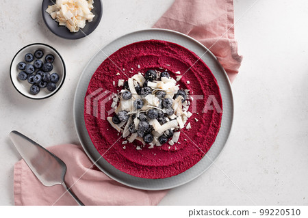 raw vegan cake with blueberries and coconut chips. Gluten free, sugar free vegan food raw vegan cake with blueberries and coconut chips. Gluten free, sugar free vegan food 99220510