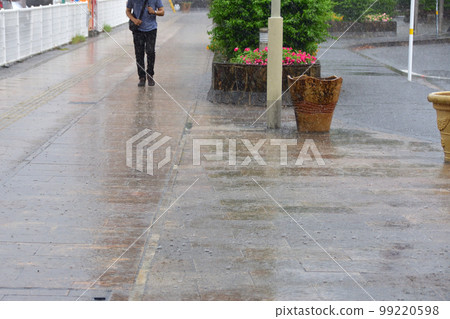 sidewalk in the rain 99220598