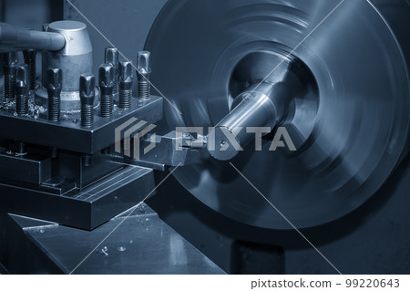 Close up scene the lathe machine finish cut the metal shaft parts by insert tools. Close up scene the lathe machine finish cut the metal shaft parts by insert tools. 99220643