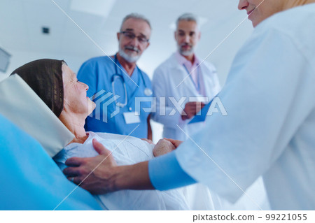 Senior woman lying in hospital room after chemotherapy. 99221055