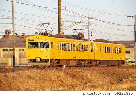 A yellow local train running along the Nakaumi line in the evening A yellow local train running along the Nakaumi line in the evening 99221880