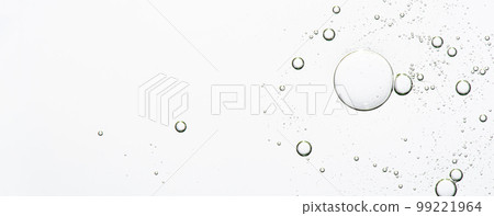 The texture of a cosmetic serum with bubbles in closeup. Macrophotography The texture of a cosmetic serum with bubbles in closeup. Macrophotography 99221964