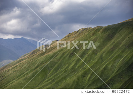 Mountains covered with moss against the blue sky. Mountains covered with moss against the blue sky. 99222472