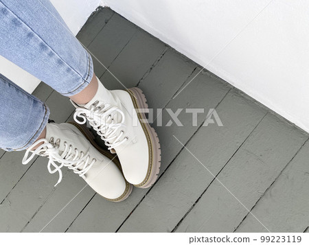 female legs in high boots. fashionable young woman 99223119