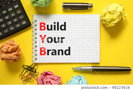 BYB build your brand symbol. Concept words BYB build your brand on white note on a beautiful yellow background. Calculator. Business and BYB build your brand concept. Copy space. BYB build your brand symbol. Concept words BYB build your brand on white note on a beautiful yellow background. Calculator. Business and BYB build your brand concept. Copy space. 99223616