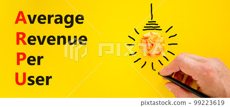 ARPU average revenue per user symbol. Concept words ARPU average revenue per user on yellow paper on beautiful yellow background. Business ARPU average revenue per user concept. Copy space. 99223619