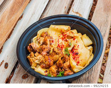 Close up shot of hand pulled noodle with chicken Close up shot of hand pulled noodle with chicken 99224215