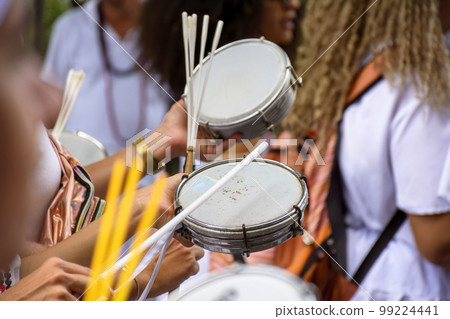Tambourine player in crowded brazilian streets Tambourine player in crowded brazilian streets 99224441